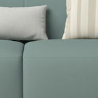 Avenoire Loveseat seat cushion seam and cream striped pillow detail