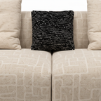 Belmora Sofa ivory woven fabric center seam and black pillow texture close-up