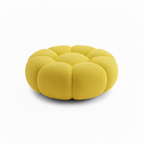 Cielmont Bellac Stool side profile showing rounded upholstered pouf shape and piped seams on a white background