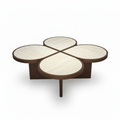 Evaroque Coffee Table straight front view with four rounded tabletop sections and dark wood edging on white background