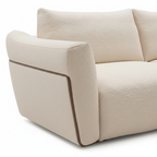Fiorenne Loveseat ivory fabric right arm and side base close-up