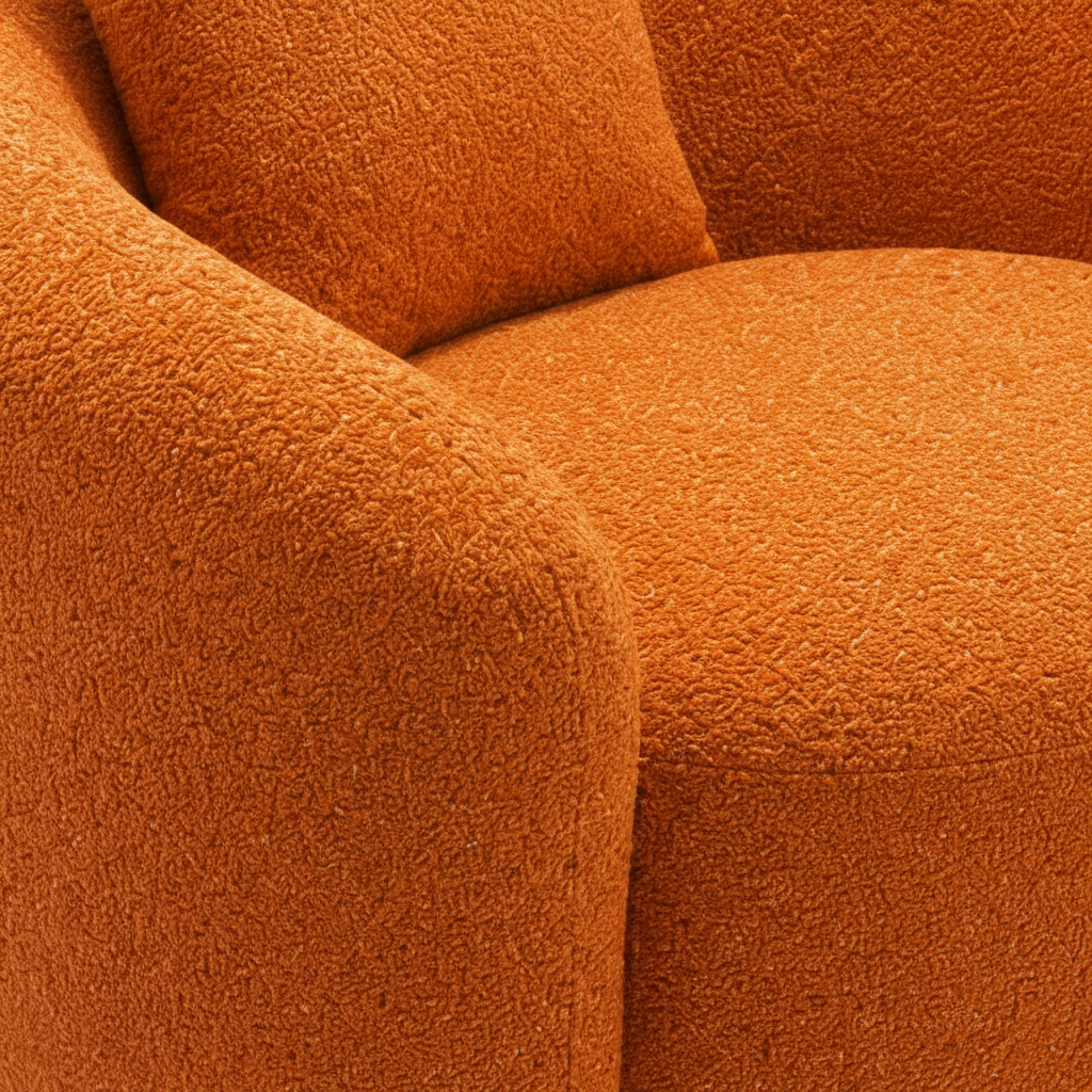 Franchet Accent Chair close-up of orange textured upholstery on the rounded arm and seat