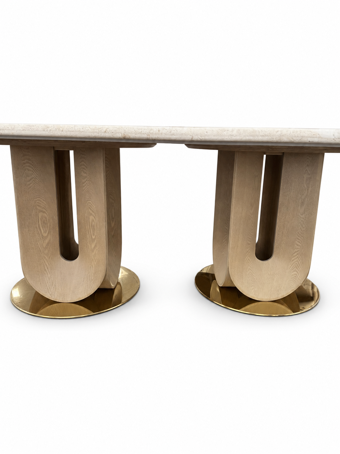 Verona Marble Dining Table base detail, showing two light wood-tone U-slot pedestal assemblies, separate gold-tone circular bases and a pale travertine tabletop edge on white.