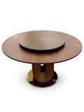 Vincennes Round Wood Dining Table with a wood-grain tabletop, matching raised turntable, curved U-shaped pedestal and circular gold base, on a white background