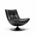 Lorviano Noir Accent Chair with dark upholstery, a curved backrest, and a sculptural base on a white background.
