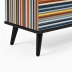 Viva Sideboard Close-up of Viva Sideboard black round hardware, striped panels, lower frame, and tapered leg on white.