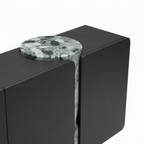 Wrenford Sideboard Close-up of the Wrenford Sideboard top surface, central stone detail, and black cabinet edge.