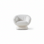 Zelmira Accent Chair with upholstered seating, a quilted backrest, curved arms, and a supportive base on a white background.