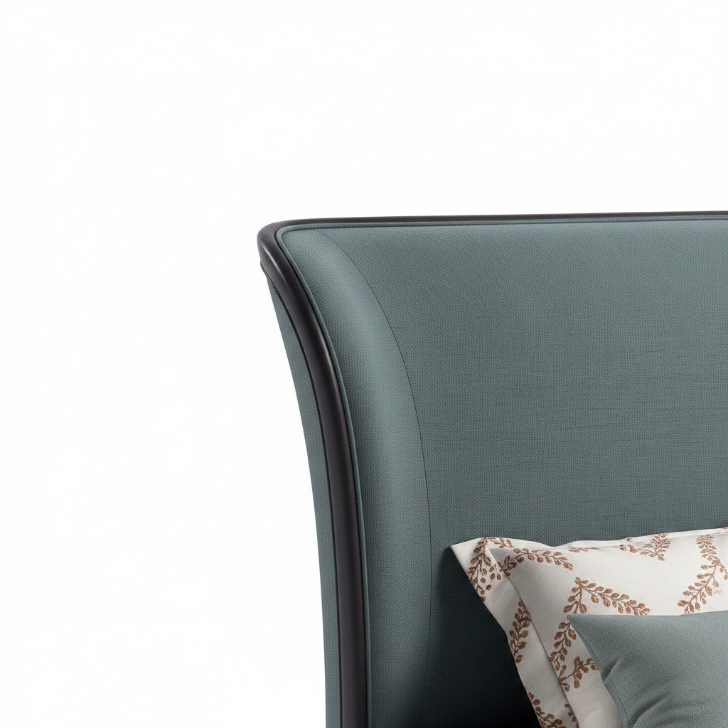 Avenoire Bed close-up of curved upholstered headboard edge detail on a white background