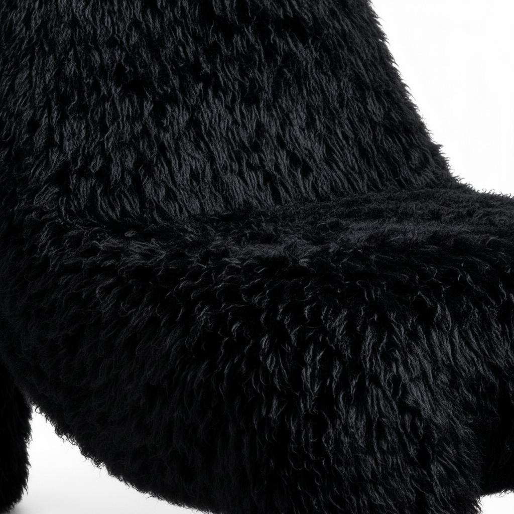Brisano Accent Chair black plush upholstery detail showing the long-pile texture and soft padded finish.