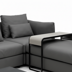 Caelis Sectional right return upholstery and black metal side table frame detail