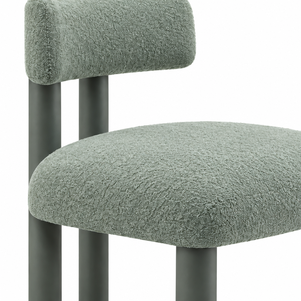 Close-up of the leg and frame on green Almerique Dining Chair