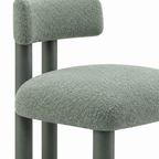 Close-up of the leg and frame on green Almerique Dining Chair