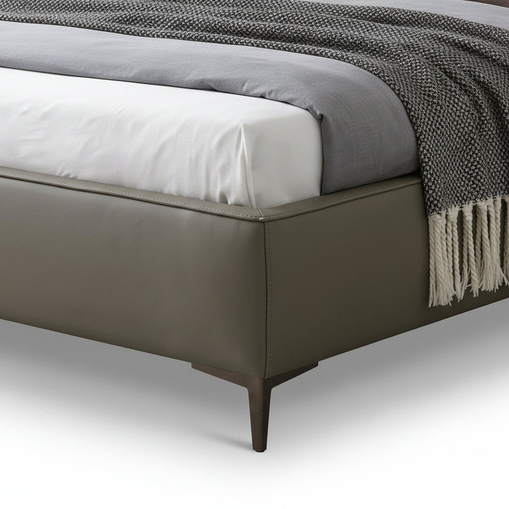Davenor Bed close-up of upholstered side rail, original bedding edge, visible seam, and tapered leg