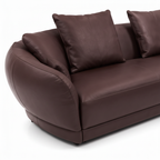 Elmont Sectional rounded arm, curved upholstery seam, and pillow detail