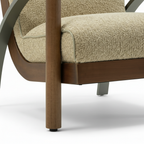 Foscano Accent Chair close-up showing the upholstered base and wooden leg detail