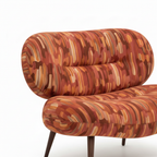 Foscelle Accent Chair rolled backrest detail showing the padded upholstery and curved construction.