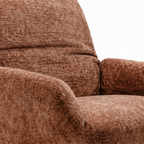 Gessaro Accent Chair backrest and armrest detail showing the textured fabric upholstery and curved padded design.