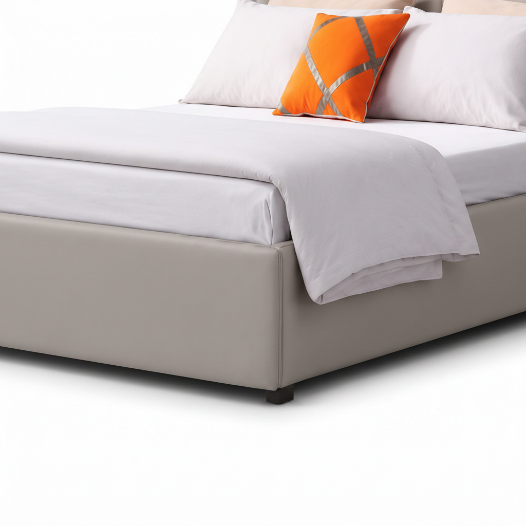 Hadley Bed close-up of upholstered footboard, white bedding edge, soft throw, and lower frame