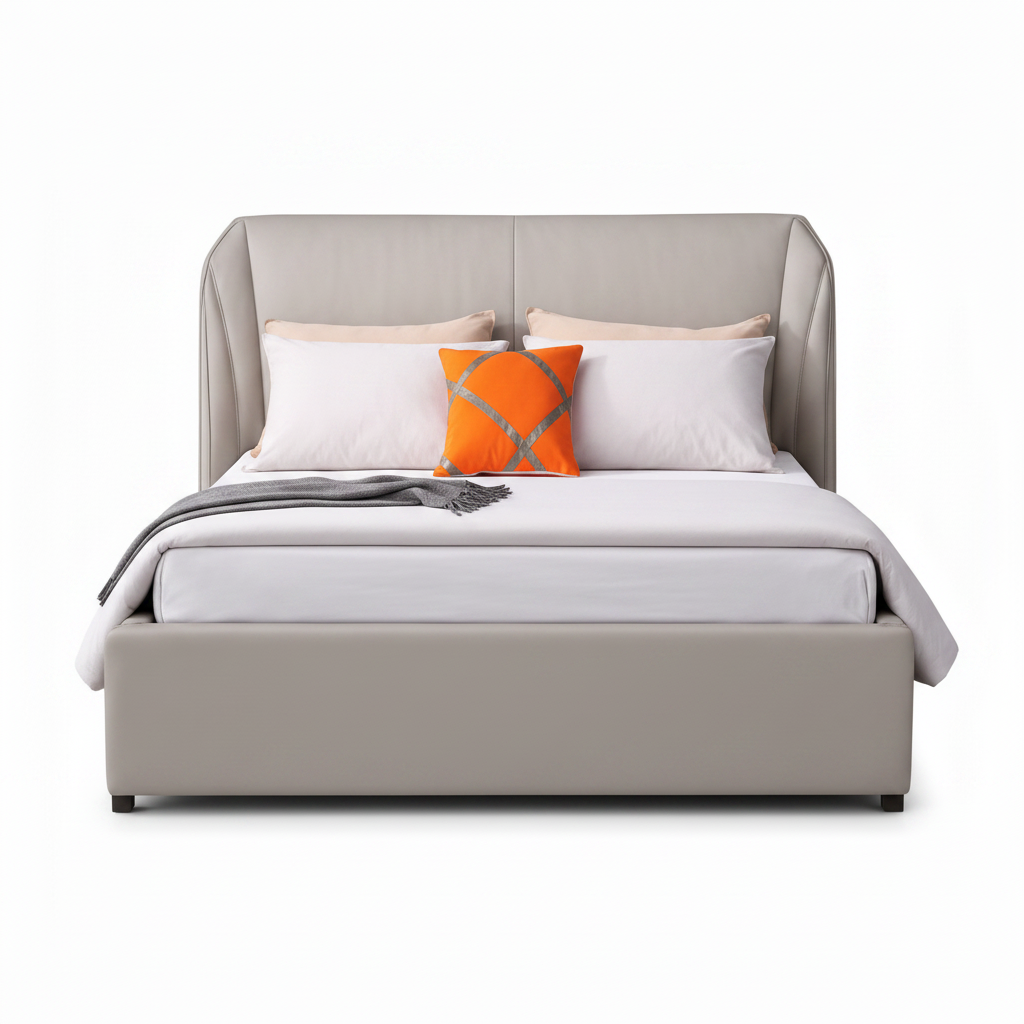Hadley Bed straight-on front view with white bedding, orange accent cushion, upholstered footboard, and white background