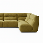 Juraine Sectional upholstery fabric, cushion seams, corner join, and right armrest detail on a white background