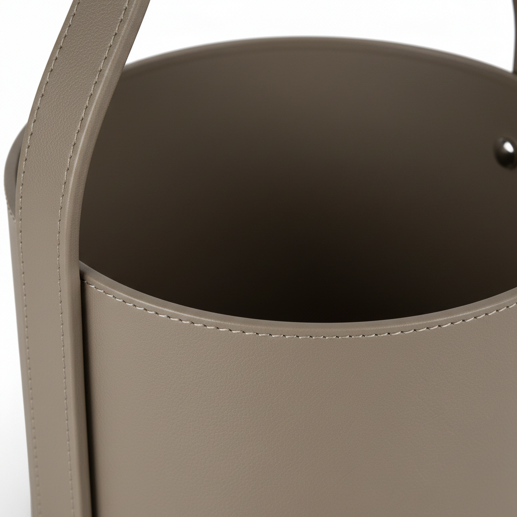 Close-up of the lower circular saddle-leather frame, inner rim, and stitching on the Lorisse End Table