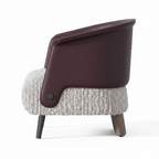 Mavero accent chair right-side view with opening facing left, plum brown leather and white boucle