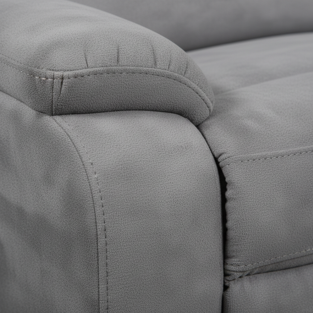 Close-up of the Hautere sectional's woven upholstery fabric with piping seams and cushion edge on a white background.