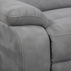 Close-up of the Hautere sectional's woven upholstery fabric with piping seams and cushion edge on a white background.