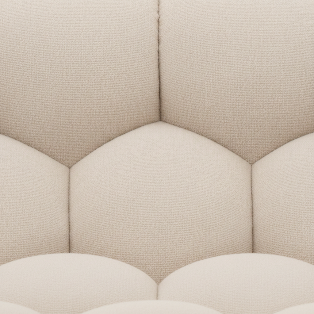 Close-up of the ivory fabric texture and channel quilting on the Cielmont Ardin Sofa
