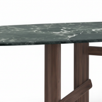 Close-up of Cortina Marble Dining Table ash wood base and marble tabletop connection on white background