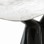 Close-up of Sylvere Dining Table marble tabletop and stainless steel base connection