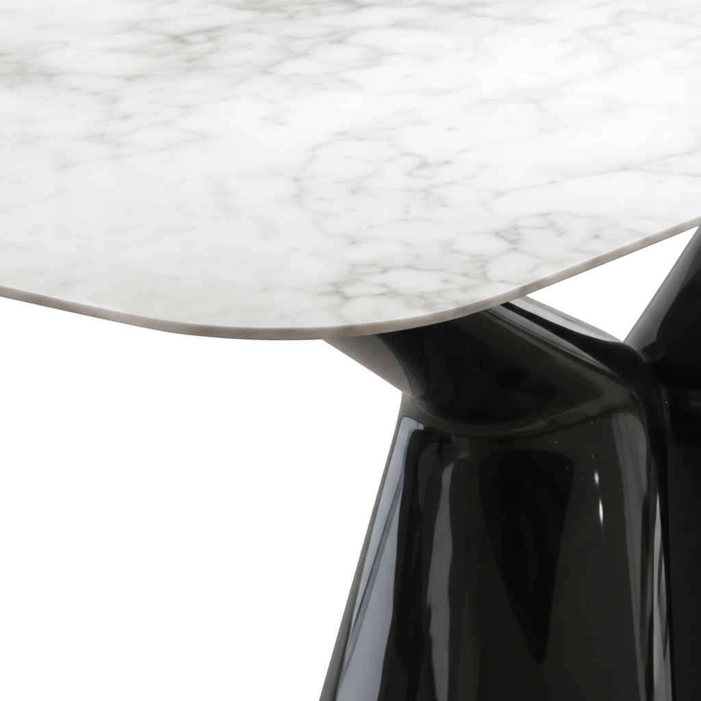 Close-up of Sylvere Dining Table marble tabletop and stainless steel base connection