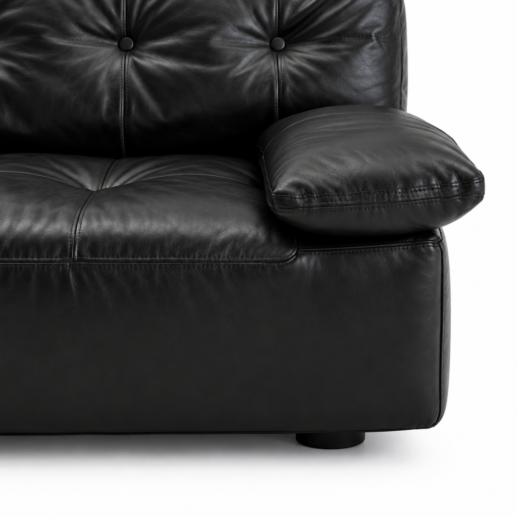 Liorenzo Sofa black leather arm cushion, seat stitching and foot close-up