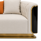 Palisandre Loveseat orange cushion, cream seat and gold base close-up