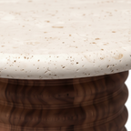 Close-up of the creamy natural stone tabletop on the Pavero End Table