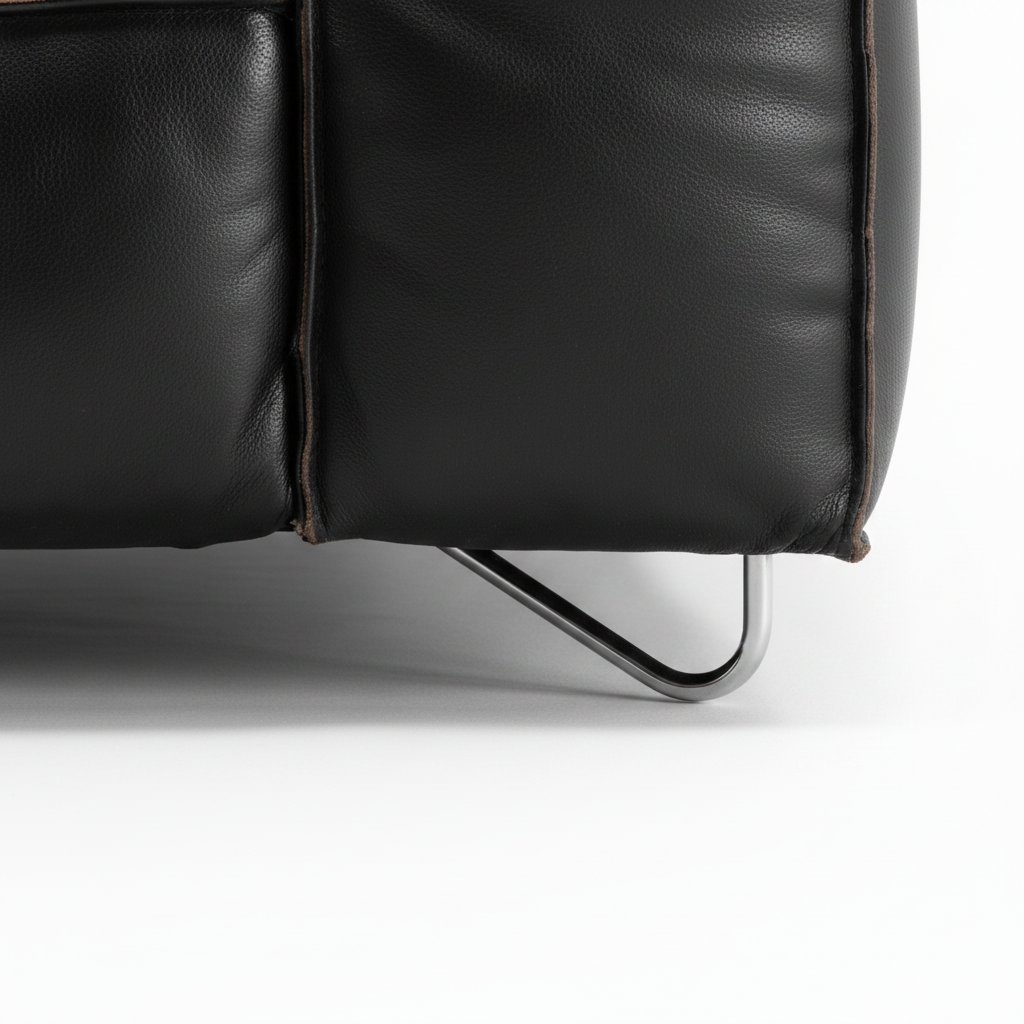 Cormaro Sofa black leather lower base and metal leg close-up