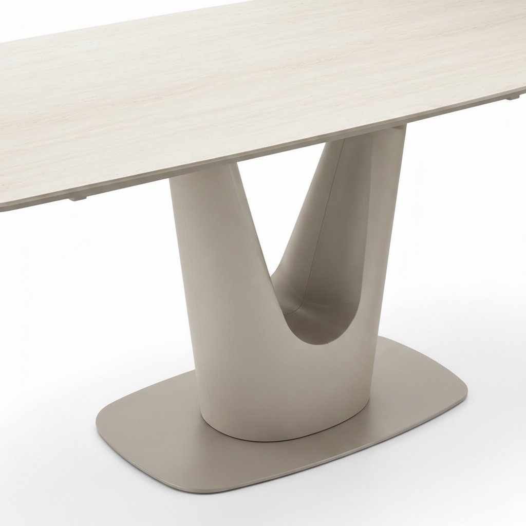 Gavriel travertine dining table sculptural pedestal and rounded base detail