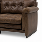 Wistere Sofa brown upholstered right rolled armrest side panel and foot detail