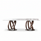 Marcelline Dining Table straight-on front view with white natural marble top, intertwined wood bases, and oval metal plates