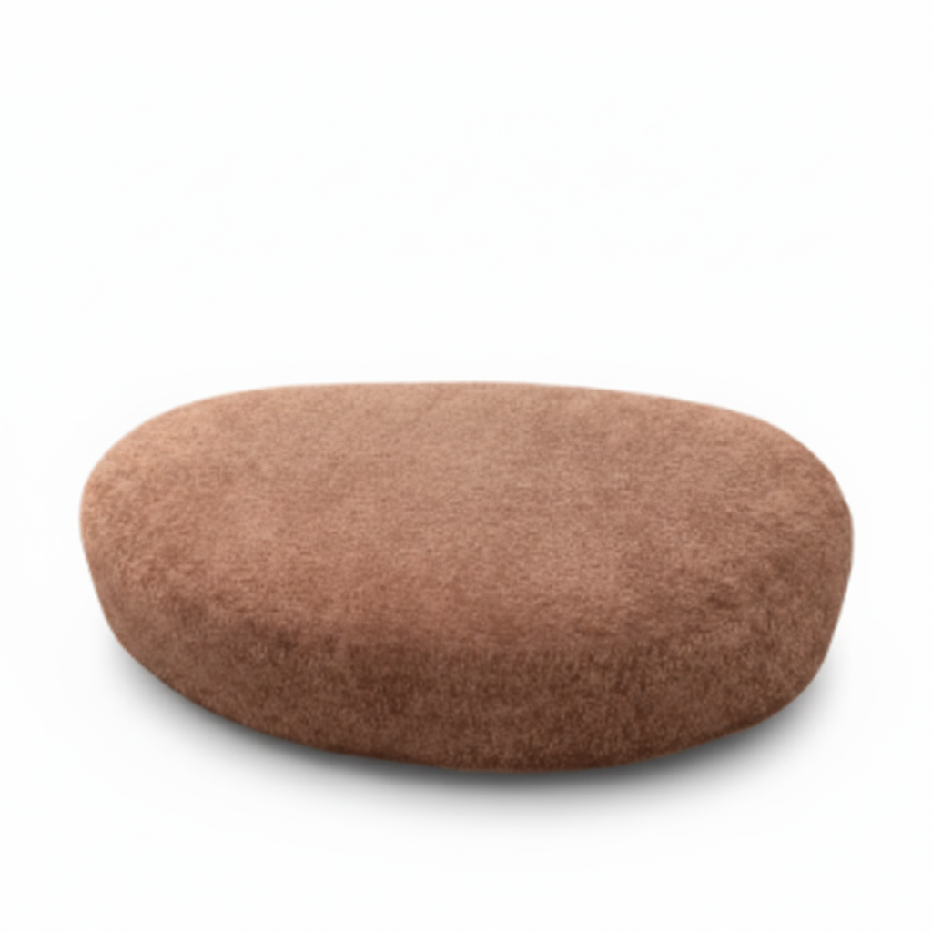 Close-up of the brown fabric texture and rounded upholstered edge on the Lacour Corsa ottoman.