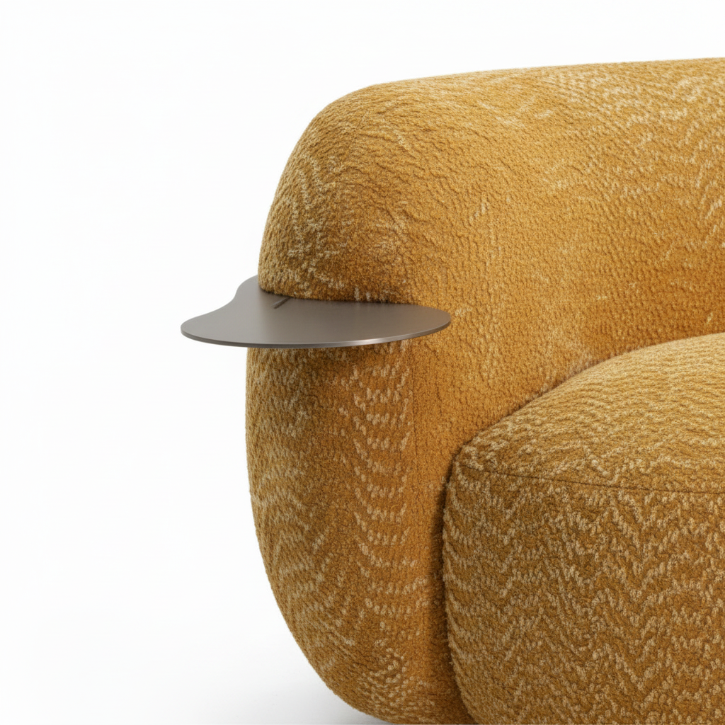 Close-up of the silver oval armrest plate and textured upholstery on the Lourmarin Sofa