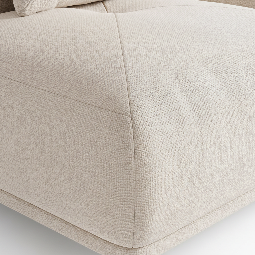 Close-up of the Savelier sectional's woven upholstery fabric with piping seams and cushion edge on a white background.
