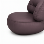 Gavelle leather accent chair rounded upholstered base and seam detail on white background