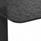 Close-up of the textured black glass tabletop on the Zavelle End Table