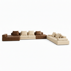 Brenoir Noir Sofa modular sectional sofa, elevated front view showing seat depth, cushions, seams, and chaise on white