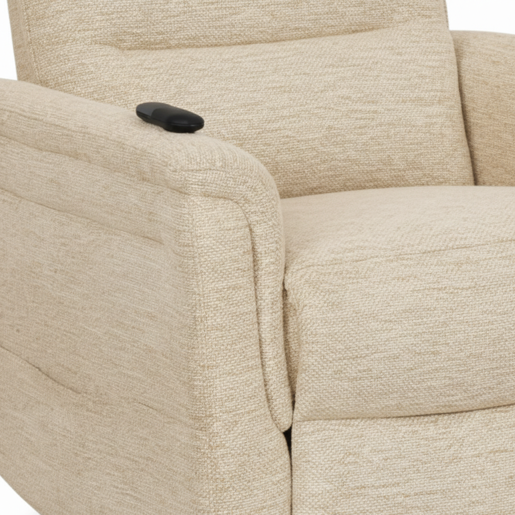 Close-up of the light beige fabric texture, padded armrest, seat seam, backrest, and recliner control on the Vaudelle accent chair.