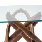 Close-up of the solid ash wood support structure beneath Elaris Glass Dining Table