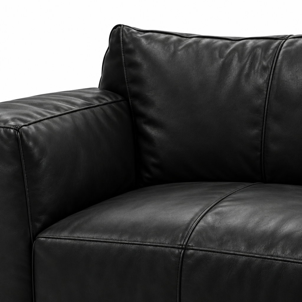 Selvano Sofa black leather armrest cushion junction and seam detail on a white background