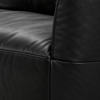 Selvano Sofa black leather upholstery texture and stitched seam detail on a white background